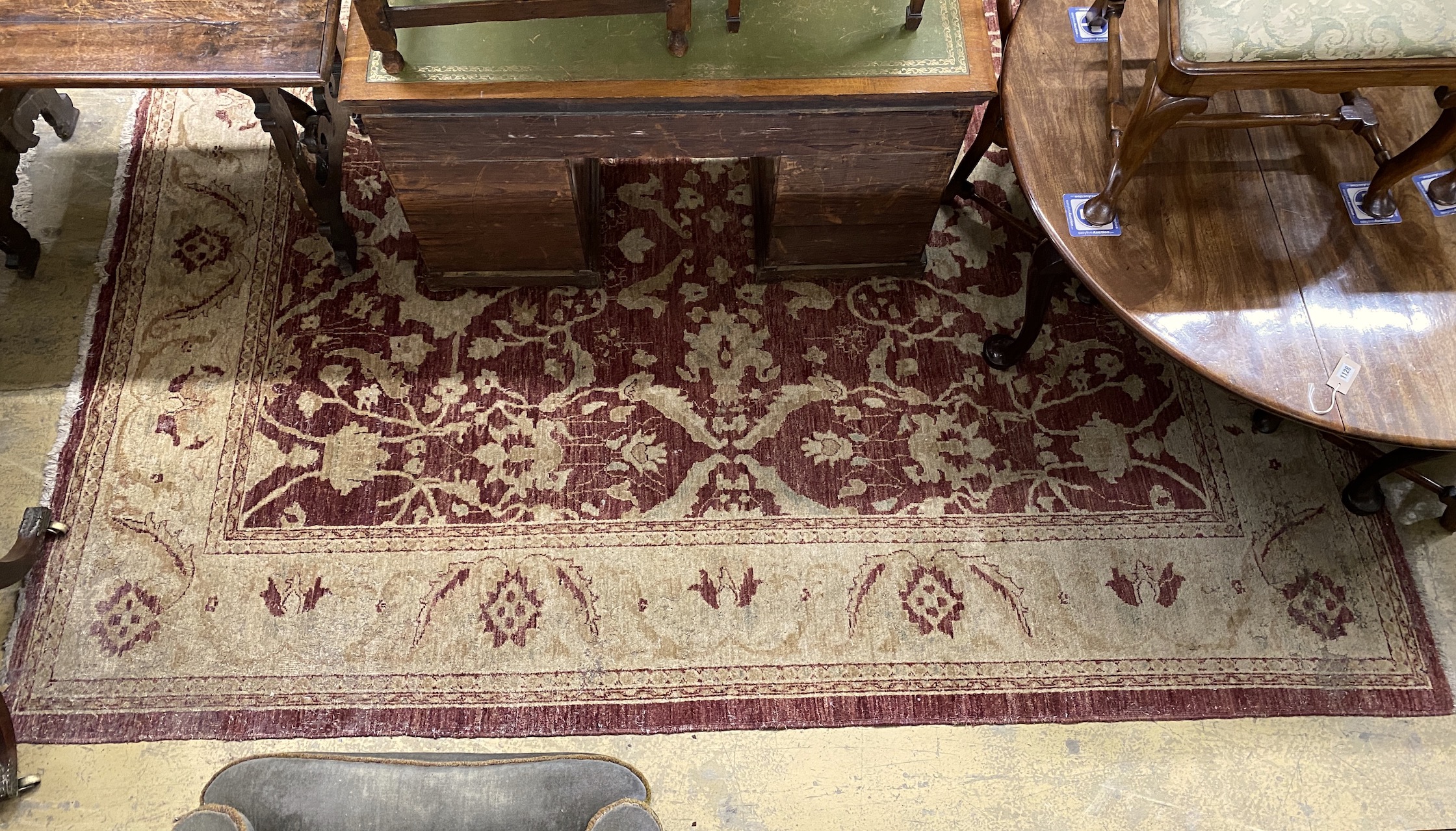 A Zeigler style burgundy ground carpet, 306 x 245cm